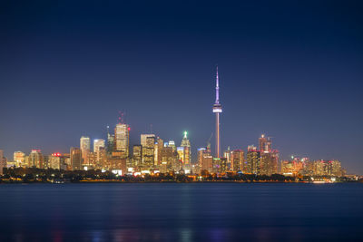 Illuminated buildings in city at night