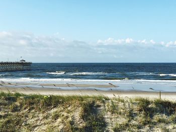 Scenic view of beach against sky