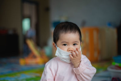 Portrait of baby girl wearing mask
