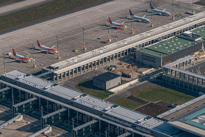 High angle view of airplane flying over city