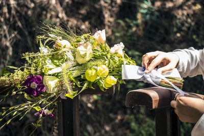 Close-up of hand holding bouquet