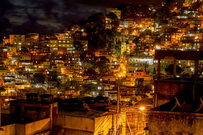 Aerial view of city lit up at night