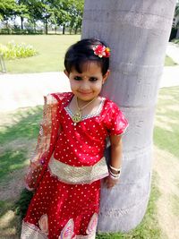 Portrait of smiling girl standing outdoors