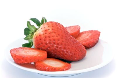 Close-up of strawberries on white background