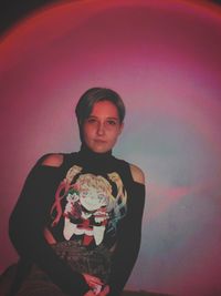 Portrait of young woman with balloons