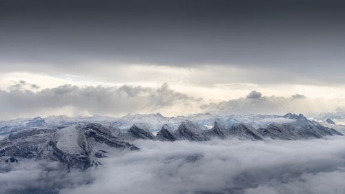 Scenic view of snowcapped mountains against sky