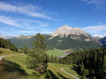 Scenic view of landscape and mountains against sky