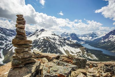 Stack of rock against sky during winter