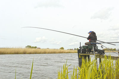 Man fishing in lake