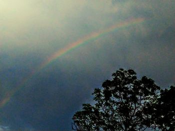 Low angle view of rainbow against sky