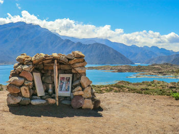 View of rocks and mountains against sky