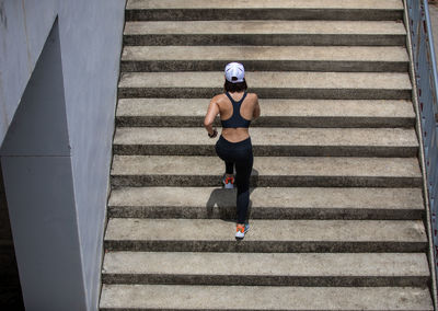 Full length of man running on staircase