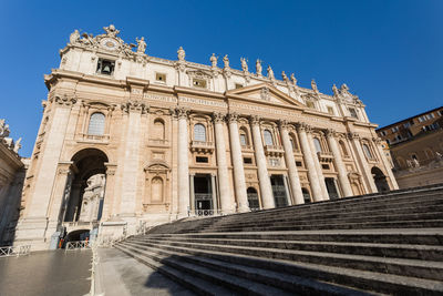 Low angle view of historical building against blue sky