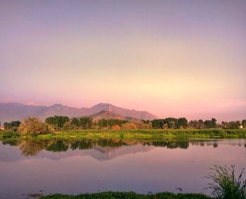 Scenic view of lake against sky during sunset