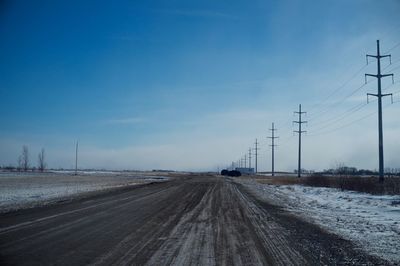 Country road against clear sky