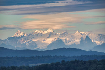 Scenic view of mountains against sky during sunset