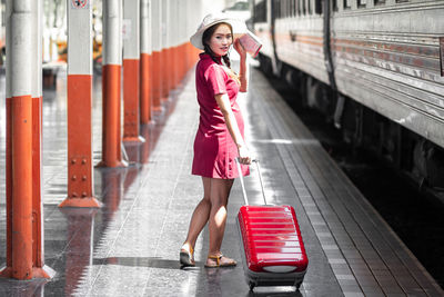 Full length of woman standing in city