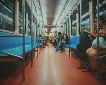 Passengers sitting in rain