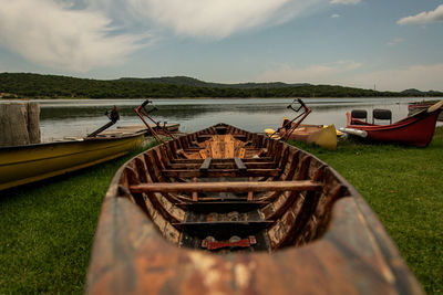 Panoramic view of boats moored in lake against sky