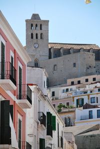 Low angle view of buildings against clear sky