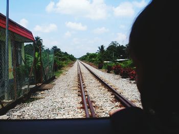 View of railway tracks against cloudy sky