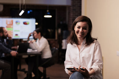 Portrait of businesswoman sitting at office