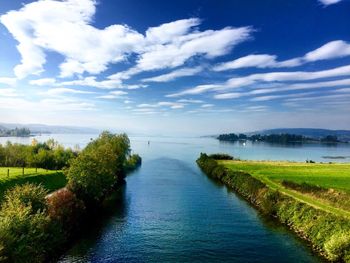 Scenic view of landscape against cloudy sky