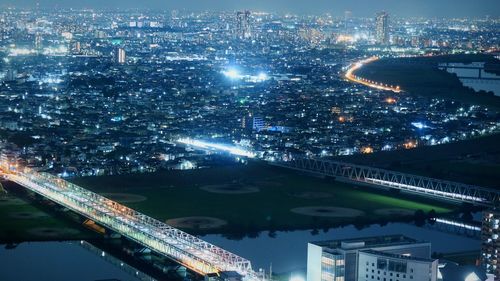 High angle view of illuminated cityscape at night