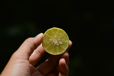 Close-up of hand holding fruit