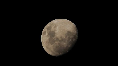 Low angle view of moon against clear sky at night