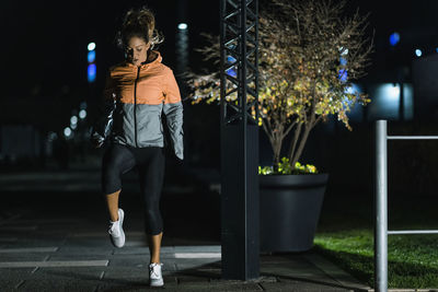 Woman exercising late at night