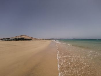 Scenic view of beach against clear sky