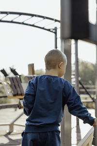 Cute kid, boy exercising on sport ground, children's sports entertainment