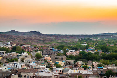 High angle view of townscape against sky during sunset