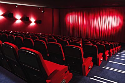 View of red chairs in auditorium