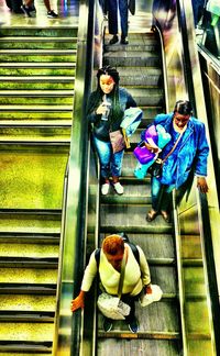High angle view of people sitting on steps
