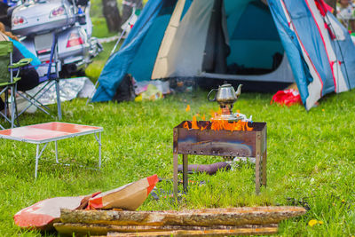 Camping outdoors - tents, equipment and cooking. cooking over a campfire on the camping.