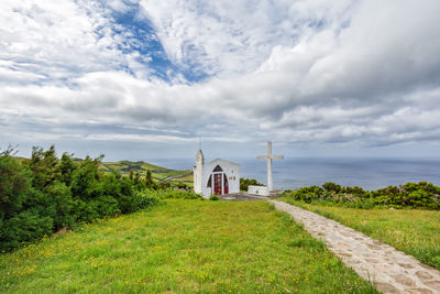 Built structure on land by building against sky