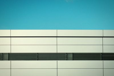 Low angle view of building against clear blue sky