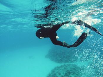 Person scuba diving undersea