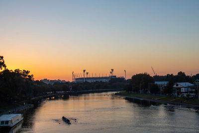 Scenic view of river against sky during sunset