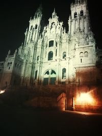 Low angle view of illuminated buildings at night