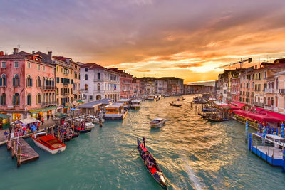 High angle view of boats in canal against buildings