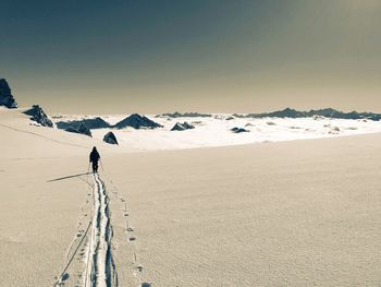 Scenic view of snowcapped landscape against sky