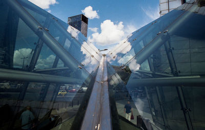 Low angle view of amusement park ride against sky