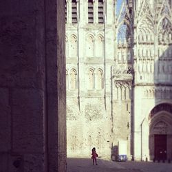 Woman standing in front of building