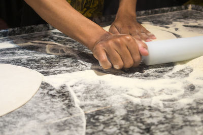 Close-up of man preparing food