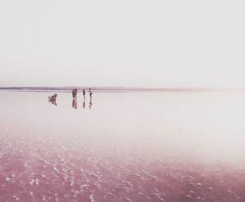 Reflection of people in water