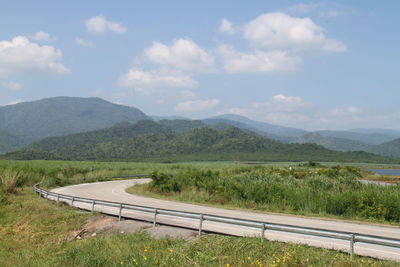 Scenic view of landscape and mountains against sky