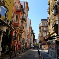 Street amidst buildings against sky